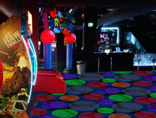 Carpet Spotlight arcade scene. Black with circles blue, red, purple, green and gray